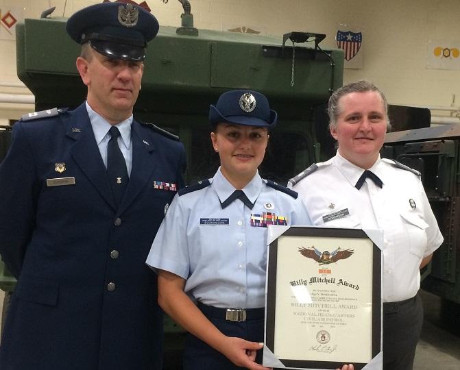 Olga Boukhvalova (‘17), receiving the General Billy Mitchell Award. From left to right stand Capt. Scott Schuman, Cadet Second Lieutenant Olga Boukhvalova, and Lt. Col. Julie Sorenson.