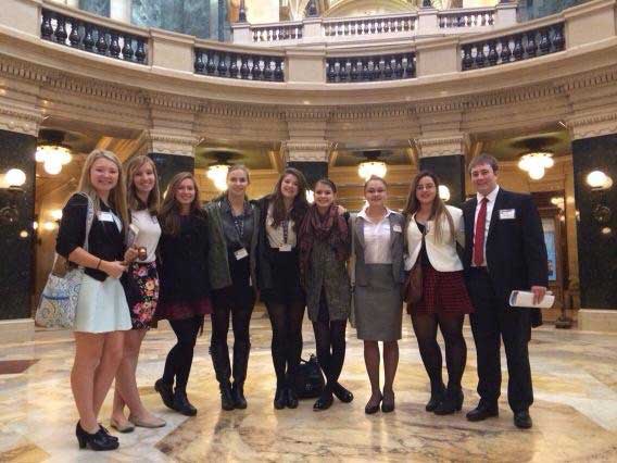 Brookfield Central Junior Statesmen of America members pose for a photo in the hall of the Capital building, after taking part in  the  Fall State competition.