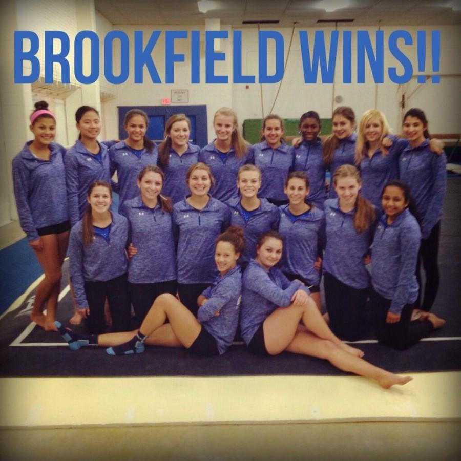 The team, consisting of both Brookfield Central and East students, celebrates after winning their first meet of the season against Port Washington.