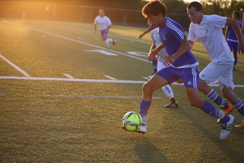 Varsity soccer player Josh Fernandez ('16) races down the field.