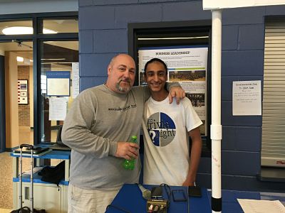 Mr. Bob Fuchs, advisor of DJ Club, and Kirat Mokha (18) play music at lunch.