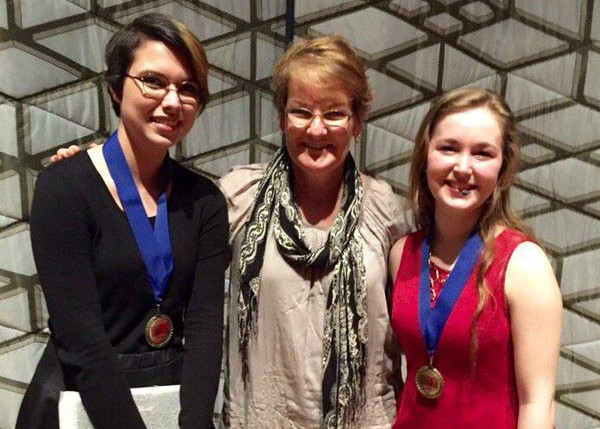 Seniors Sarah Brown and Kirsten Meier pose with Mrs. Honore Schiro following the regional Poetry Out Loud competition at the Sharon Lynne Wilson Center for the Arts.