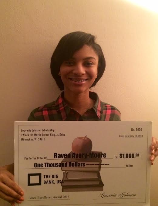 Avery-Moore (‘16) holds up her Louvenia Johnson Scholarship for 1,000 dollars. 