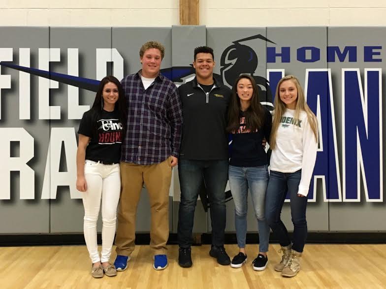 The five proud new college athletes, (from left to right) Crystal Sicard (‘16), Joey Koppelman (‘16), Brandon Hughes (‘16), Alexandrea Lee (‘16), and Olivia Zweber (‘16) pose right after signing to their future schools.