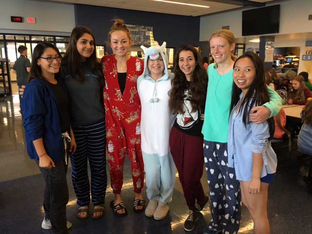 From left to right, seniors Leslie Bonilla, Sofia Khan, Victoria Tarakanova, Sophie Bohr, Emma Favil, Kathleen Wierzchowski, and Alice Zheng stand in their comfiest pajamas for Homecoming Week - PJ Day.