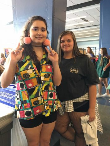 Natalie Lara ('20) and Jada Christ ('20) pose in their funkiest 90's clothes.