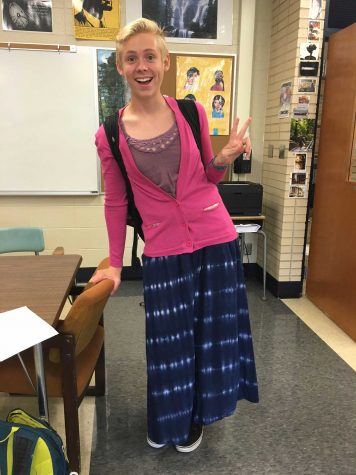 Connor Kuse ('17) wears a maxi-skirt and a pink cardigan. 