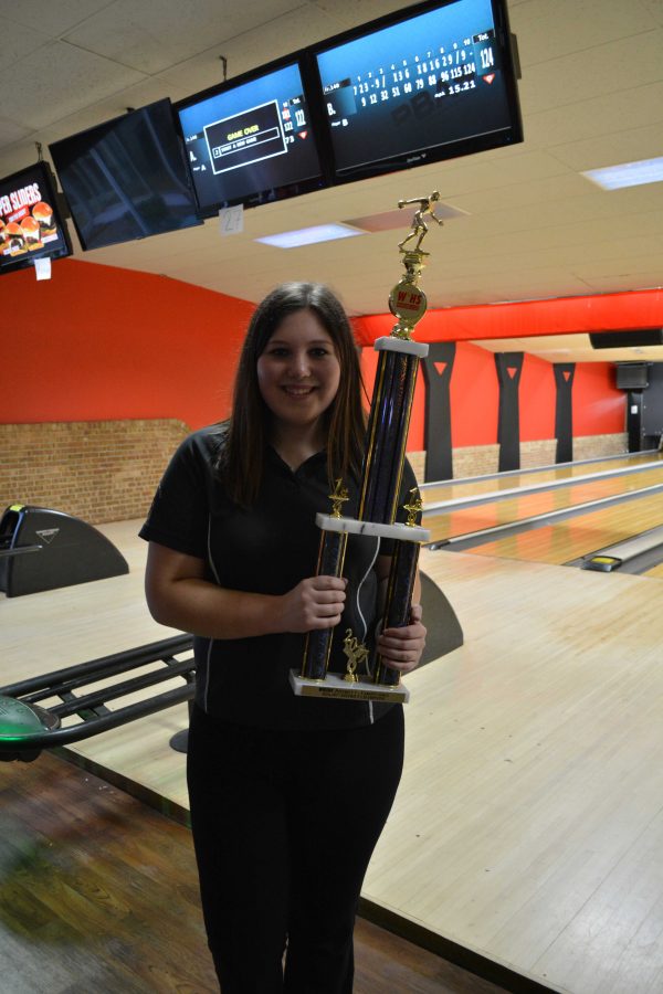 Danyell Chupp (‘17) poses with her trophy after winning a conference. Her high game for that day was 277 and her high series was 717. 