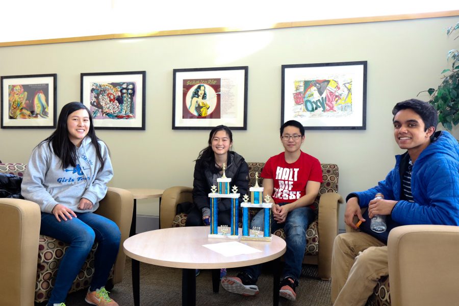 BC Chess team students Sabrina Huang (‘19),  Alena Huang (‘18), Tinglin Shi (‘18), and Nikhil James (‘18)  gather with their trophies at a chess tournament.