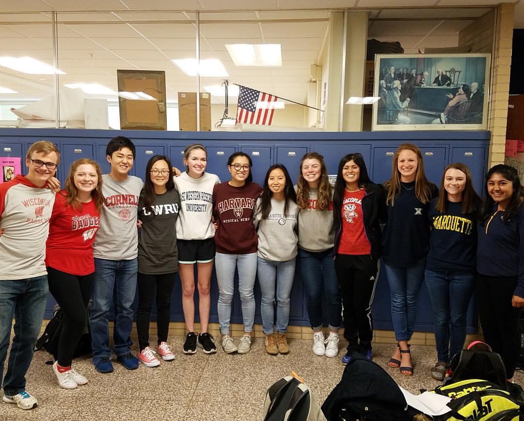 A group of BC seniors gather for a photo with their college attire May 1st.