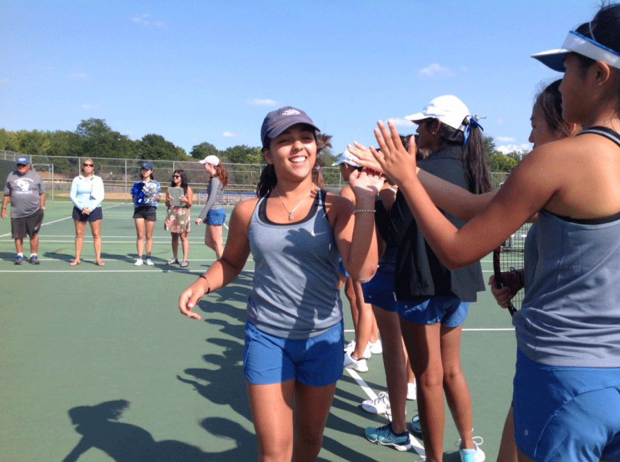 Lili del Campo (‘20) celebrates after taking on Arrowhead, giving her teammates a string of high fives.