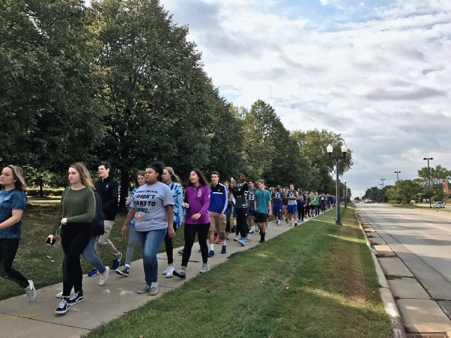 Students+walk+along+Calhoun+Rd.+to+show+support+for+victims+of+Hurricane+Harvey