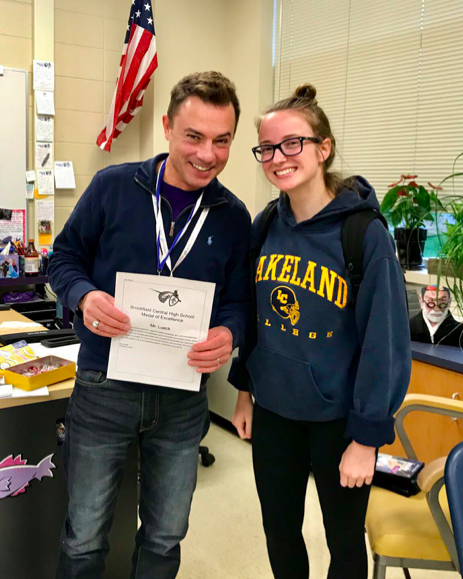 Mr. Lueck awards Mia Wedel (20) with the BCHS Medal of Excellence