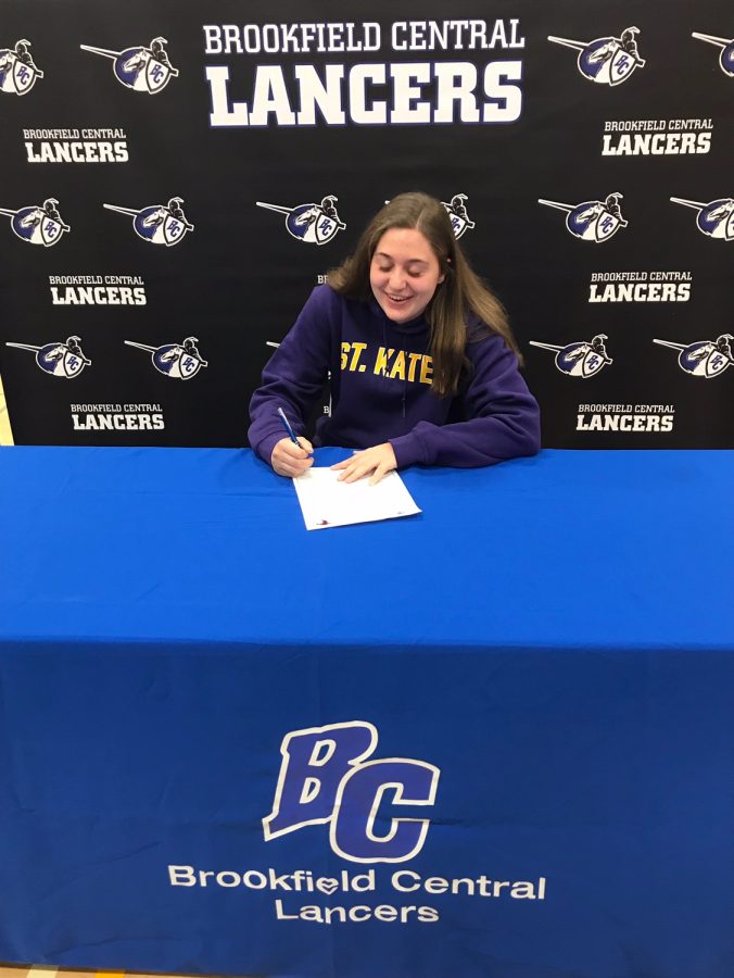 Zoe Sternberg (19) signs her letter of intent to play hockey at St. Catherines University which is located in Minnesota.