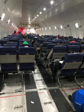 This photo, taken by JingMing Huang shows the inside of an airplane, indicating his flight back to America. Air travel has been the greatest cause of the spread of the Coronavirus due to the close proximity of people to one another and the recycling of air throughout the aircrafts. 