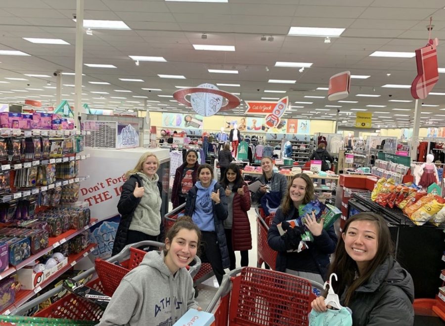 A variety of StuCo members pose for a photo in Target where they are buying gifts for families who cannot afford them. The Chirstmas Clearing Council collects money from classrooms the week before Christmas break to afford the presents and the event is a favorite among StuCo members. These service events are just one of the many reasons BC was awarded the Spirit of Excellence Award